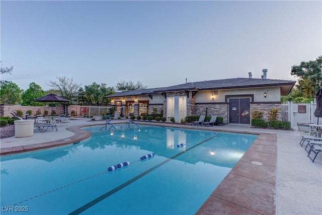 pool featuring a patio and fence