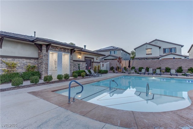 view of pool featuring a fenced in pool, a patio area, and fence