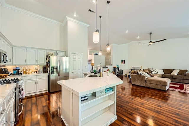 521 Dawn Cove Dr, Henderson, NV 89052 - kitchen with appliances with stainless steel finishes, crown molding, a sink, light stone countertops, and open floor plan