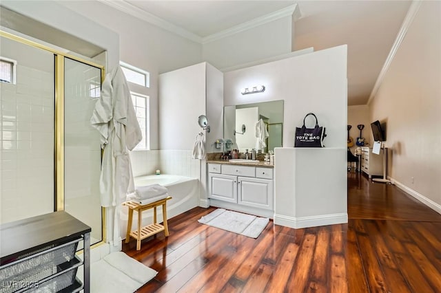 521 Dawn Cove Dr, Henderson, NV 89052 - bathroom with ornamental molding, a bath, vanity, hardwood / wood-style floors, and tiled shower