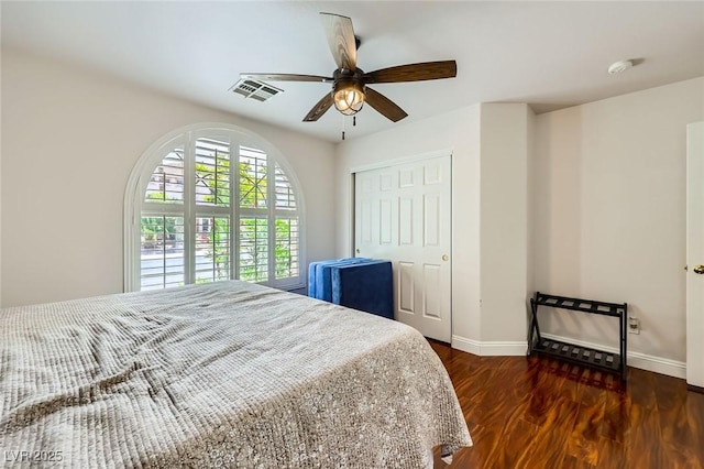 521 Dawn Cove Dr, Henderson, NV 89052 - bedroom featuring baseboards, wood finished floors, a closet, and ceiling fan