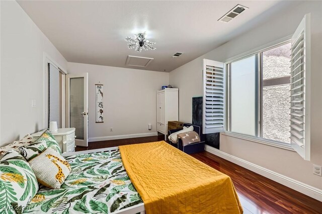 521 Dawn Cove Dr, Henderson, NV 89052 - bedroom with baseboards, wood finished floors, and attic access