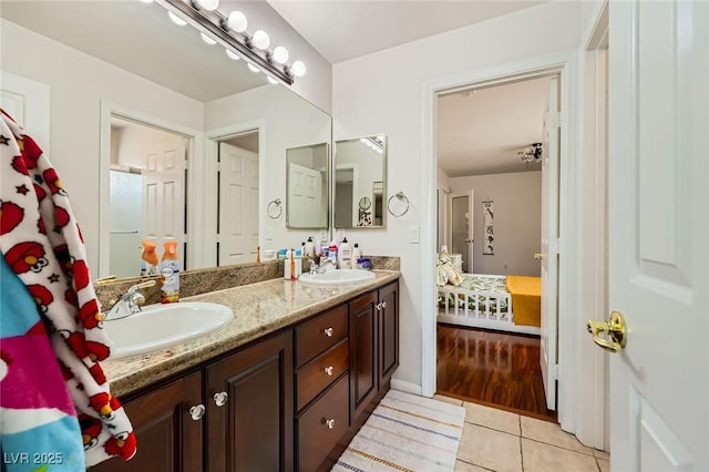 521 Dawn Cove Dr, Henderson, NV 89052 - bathroom featuring double vanity, tile patterned floors, and ensuite bathroom