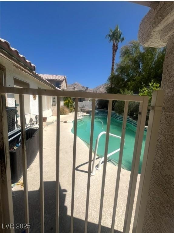view of pool featuring a fenced in pool and a patio area