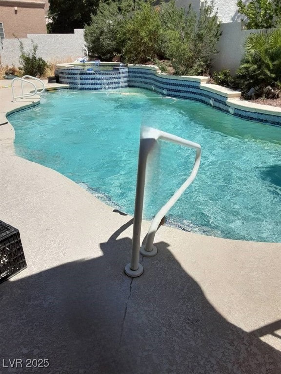 view of pool featuring a fenced in pool and fence