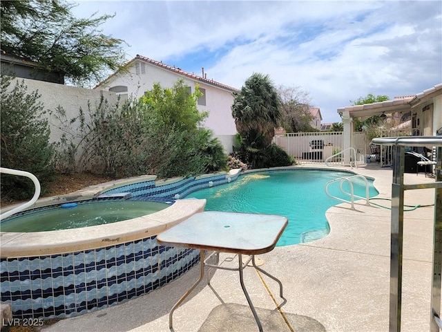 view of pool featuring a fenced backyard, a patio area, and a pool with connected hot tub