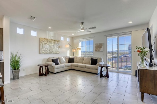 living room featuring light tile patterned floors, visible vents, a ceiling fan, and recessed lighting