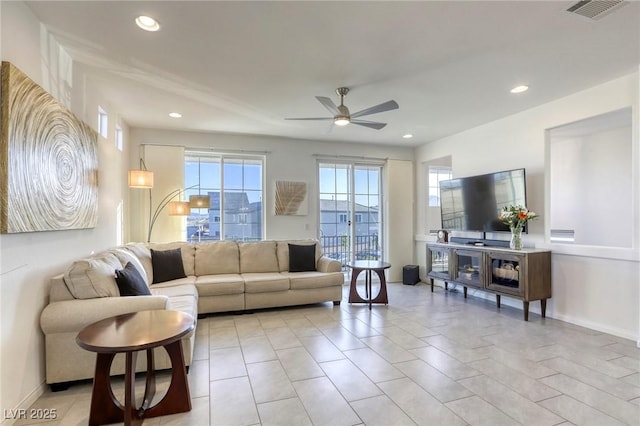 living room with recessed lighting, light tile patterned floors, a ceiling fan, visible vents, and baseboards