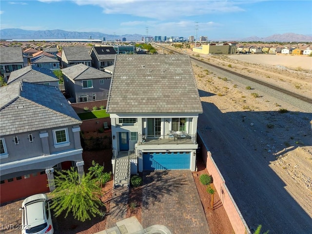 drone / aerial view featuring a mountain view and a residential view