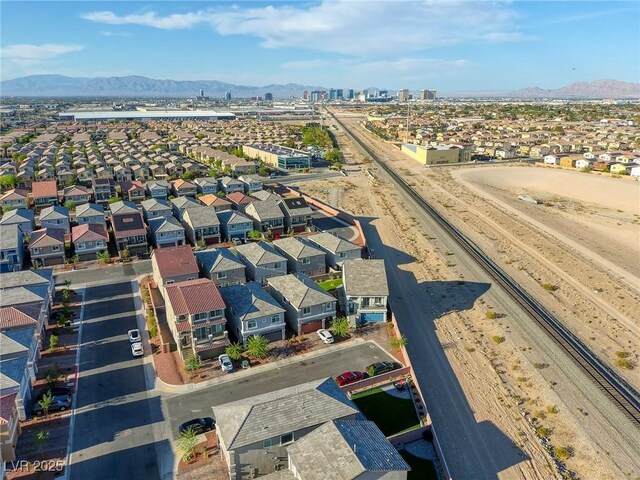birds eye view of property featuring a mountain view and a residential view