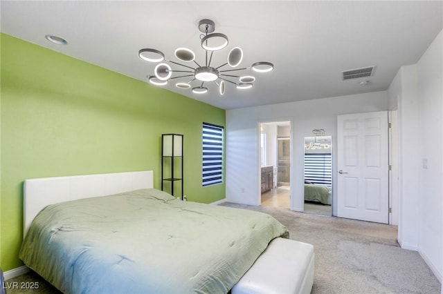 bedroom featuring a chandelier, ensuite bath, visible vents, light carpet, and baseboards