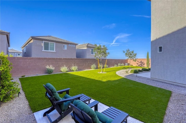 view of yard featuring a patio and a fenced backyard