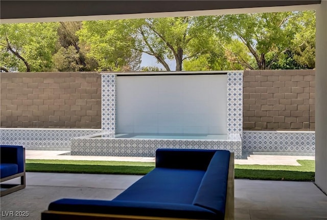 view of patio / terrace featuring fence