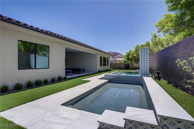 view of swimming pool with a patio area, a fenced backyard, an in ground hot tub, and a fenced in pool