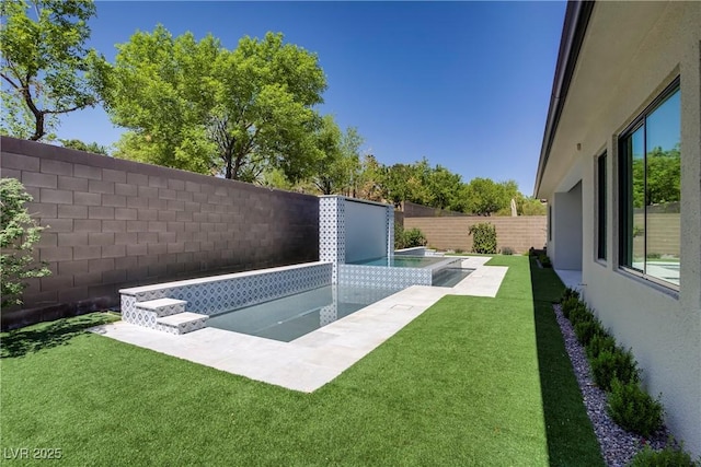 view of pool with a fenced in pool, a fenced backyard, and a lawn