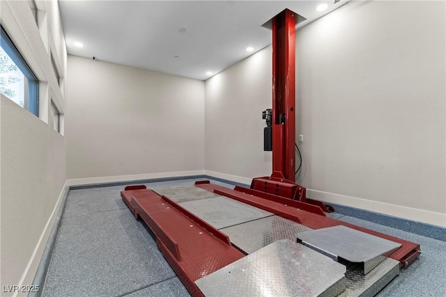 workout area featuring baseboards and recessed lighting