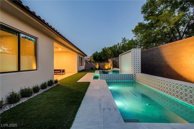 view of swimming pool featuring a fenced backyard, a fenced in pool, a patio, and a lawn