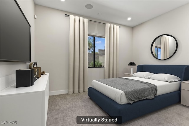bedroom with recessed lighting, light colored carpet, and baseboards