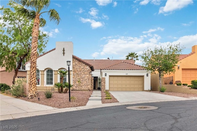 1185 Via Casa Palermo, Henderson, NV 89011 - mediterranean / spanish-style house featuring a tile roof, driveway, stone siding, a garage, and stucco siding