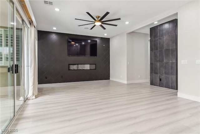 1185 Via Casa Palermo, Henderson, NV 89011 - spare room featuring visible vents, baseboards, wood finished floors, and ceiling fan