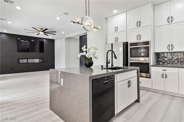 1185 Via Casa Palermo, Henderson, NV 89011 - kitchen with light wood-style floors, dishwasher, double oven, freestanding refrigerator, and recessed lighting