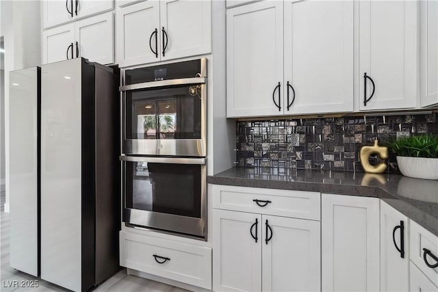 1185 Via Casa Palermo, Henderson, NV 89011 - kitchen featuring backsplash, white cabinetry, and stainless steel appliances