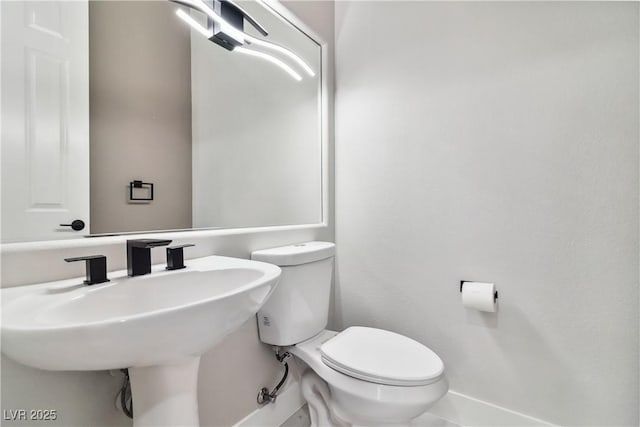 1185 Via Casa Palermo, Henderson, NV 89011 - bathroom featuring toilet, a sink, and baseboards