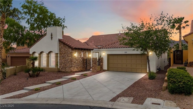 1185 Via Casa Palermo, Henderson, NV 89011 - mediterranean / spanish home featuring stucco siding, a tile roof, and a garage