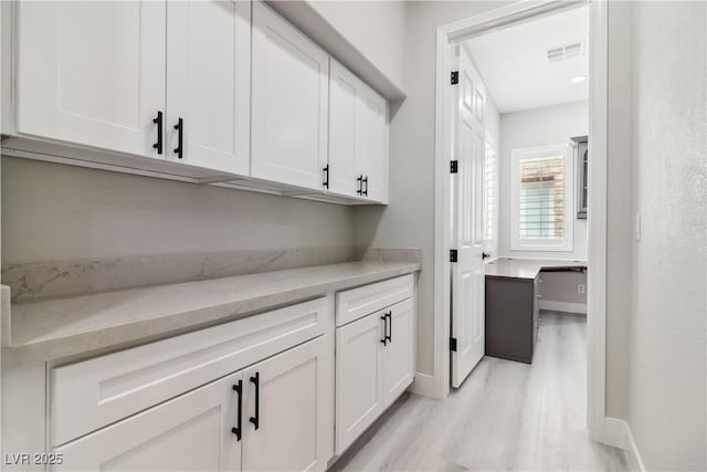 1185 Via Casa Palermo, Henderson, NV 89011 - interior space featuring light wood-style flooring, visible vents, and baseboards