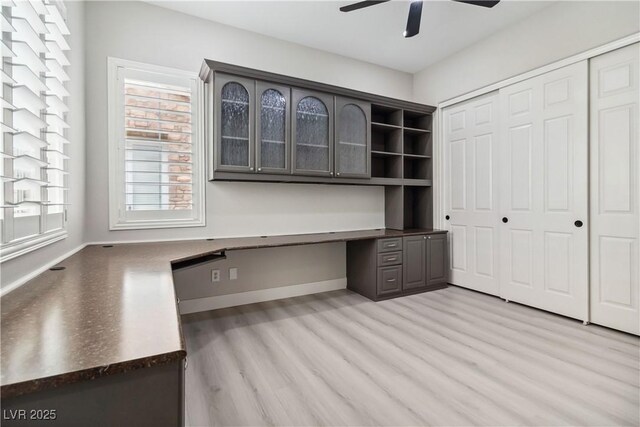 1185 Via Casa Palermo, Henderson, NV 89011 - unfurnished office featuring baseboards, built in study area, light wood-style floors, and ceiling fan