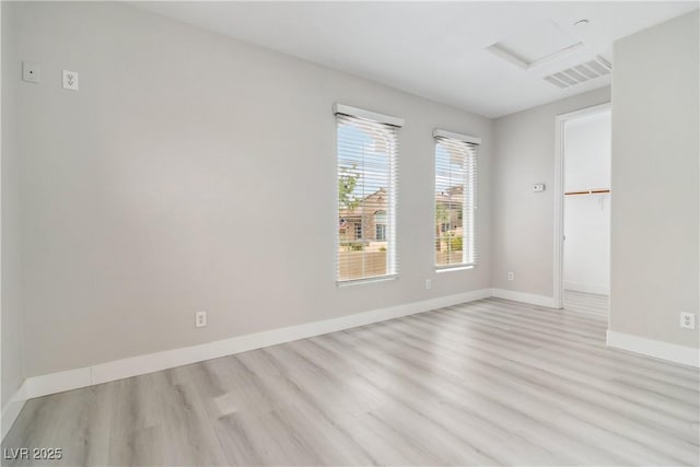 1185 Via Casa Palermo, Henderson, NV 89011 - empty room with attic access, wood finished floors, visible vents, and baseboards