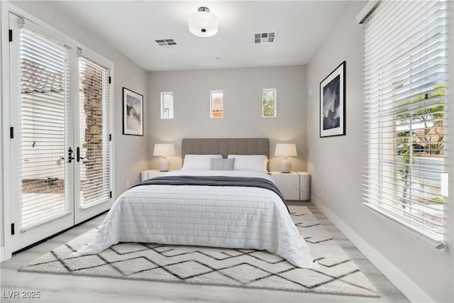 1185 Via Casa Palermo, Henderson, NV 89011 - bedroom featuring baseboards, access to exterior, visible vents, and light wood-type flooring