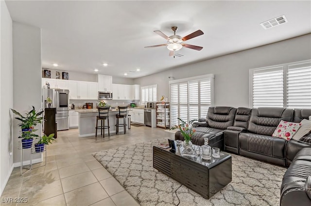 8351 Gold River Ct, Las Vegas, NV 89113 - living area featuring a ceiling fan, visible vents, recessed lighting, and light tile patterned flooring