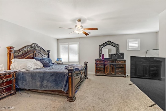 8351 Gold River Ct, Las Vegas, NV 89113 - carpeted bedroom featuring multiple windows and ceiling fan