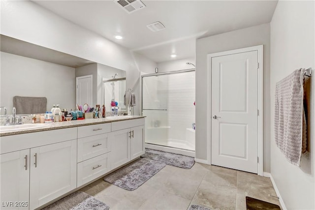 8351 Gold River Ct, Las Vegas, NV 89113 - bathroom with a stall shower, double vanity, tile patterned flooring, and recessed lighting