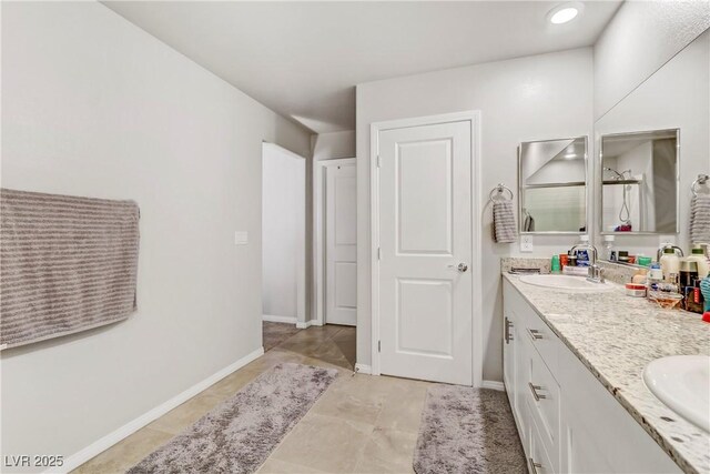 8351 Gold River Ct, Las Vegas, NV 89113 - bathroom featuring double vanity, a shower, and tile patterned floors