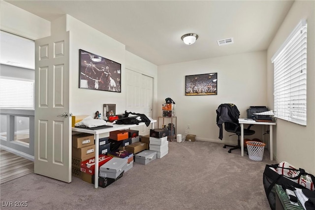 5419 Holding Ave, Las Vegas, NV 89139 - office area featuring visible vents, carpet floors, and a healthy amount of sunlight
