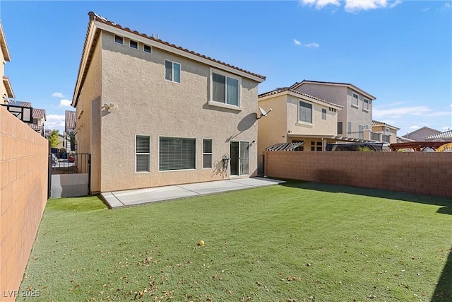 5419 Holding Ave, Las Vegas, NV 89139 - rear view of property featuring a yard, stucco siding, a fenced backyard, and a patio area