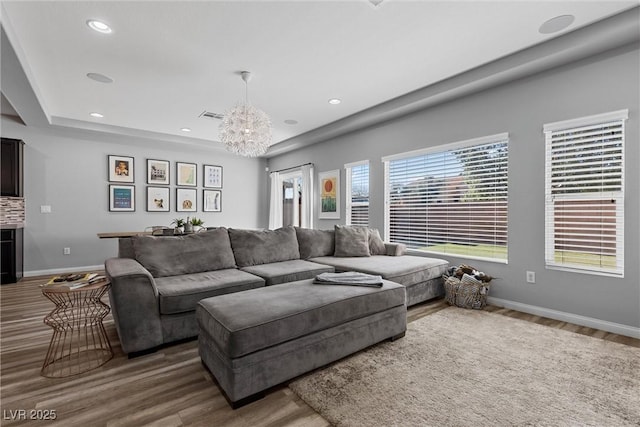 5419 Holding Ave, Las Vegas, NV 89139 - living area with a chandelier, wood finished floors, baseboards, and visible vents