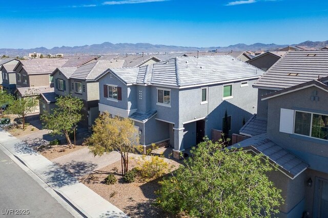 birds eye view of property featuring a residential view and a mountain view