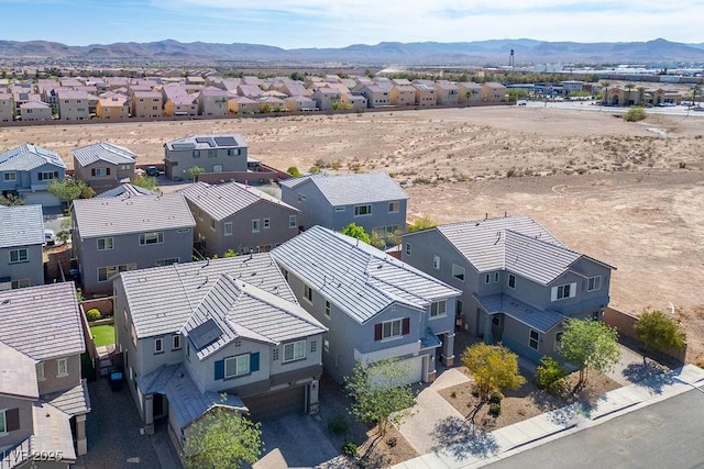 birds eye view of property with a residential view and a mountain view