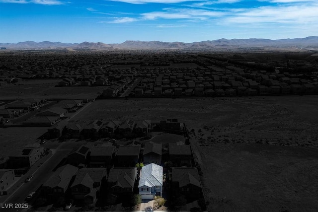 birds eye view of property featuring a mountain view