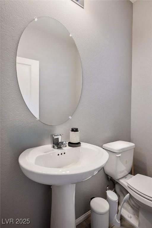 half bathroom with toilet