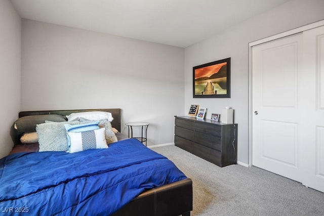 carpeted bedroom with baseboards