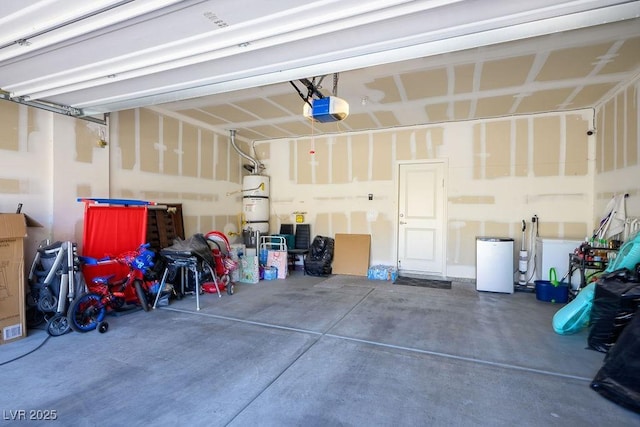 garage featuring a garage door opener and water heater