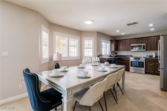 dining area with visible vents, baseboards, recessed lighting, and light tile patterned flooring