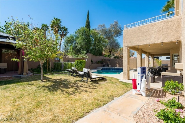 view of yard featuring a fenced backyard, a fenced in pool, and a patio