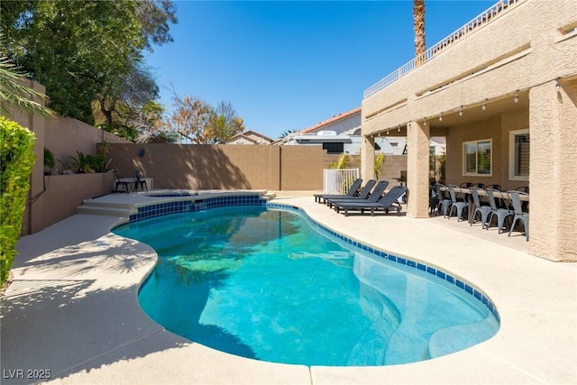 view of pool featuring a patio, a fenced backyard, and a fenced in pool