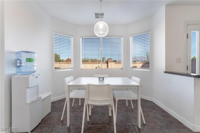 dining room featuring visible vents and baseboards