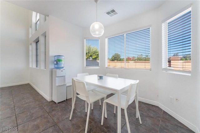 dining area featuring visible vents and baseboards